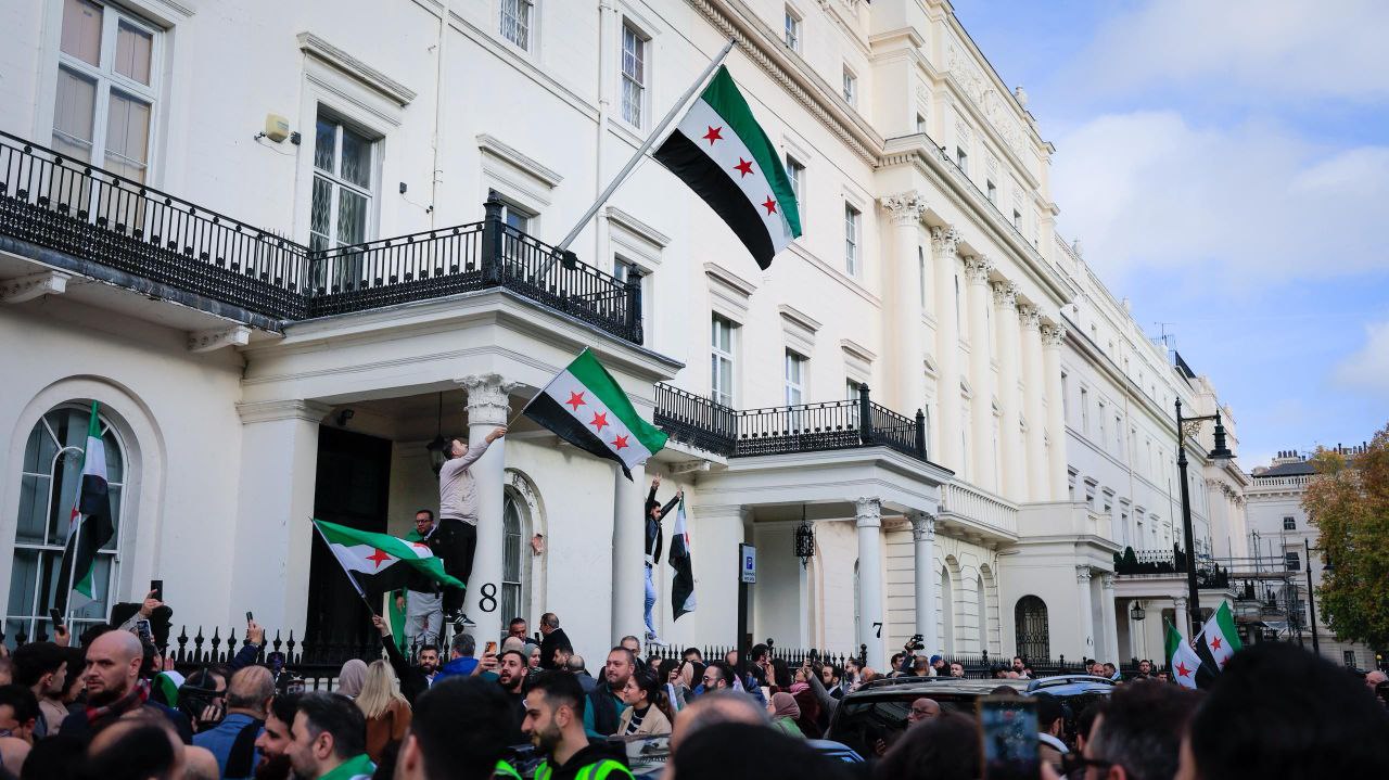 Foreign Minister and Expatriates  al-Shaibani Raises The flag of The Syrian Arab Republic above The Syrian Embassy Building in The British Capital, London