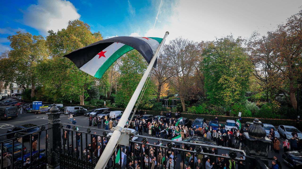 Foreign Minister and Expatriates  al-Shaibani Raises The flag of The Syrian Arab Republic above The Syrian Embassy Building in The British Capital, London