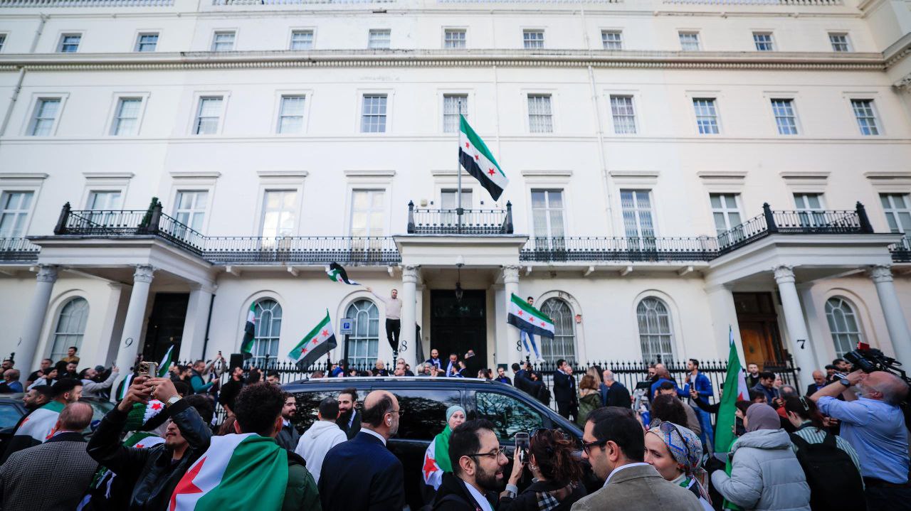 Foreign Minister and Expatriates  al-Shaibani Raises The flag of The Syrian Arab Republic above The Syrian Embassy Building in The British Capital, London
