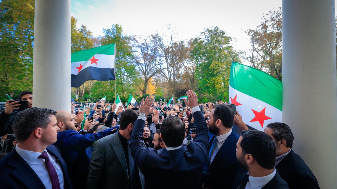 Foreign Minister and Expatriates  al-Shaibani Raises The flag of The Syrian Arab Republic above The Syrian Embassy Building in The British Capital, London